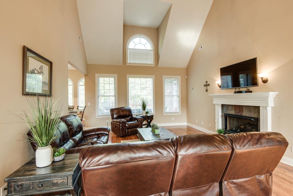 7302 Allans Ridge Lane Fairview, TN 37062 - Photo 7 of 30 a living room with furniture fireplace and a flat screen tv