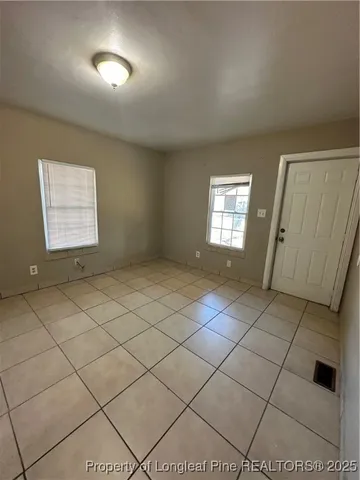 a view of an empty room and window