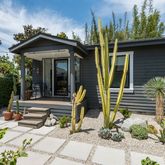a view of a chair and tables in patio of the house