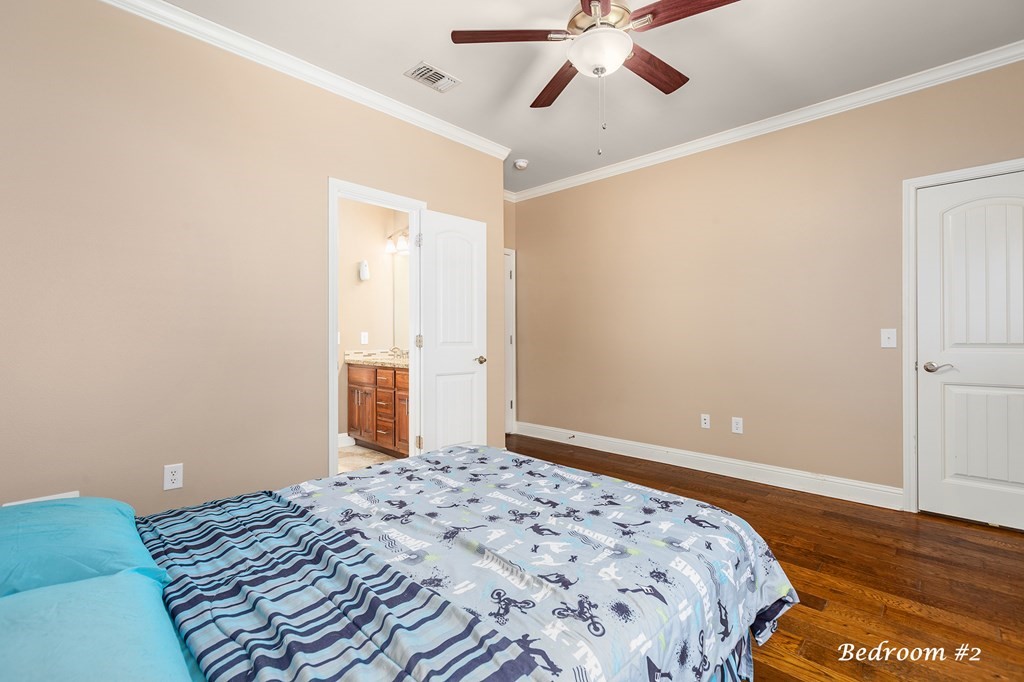1171 Old Ewing Road Lufkin, TX 75901 - Photo 25 of 49 a bedroom with bed and wooden floor