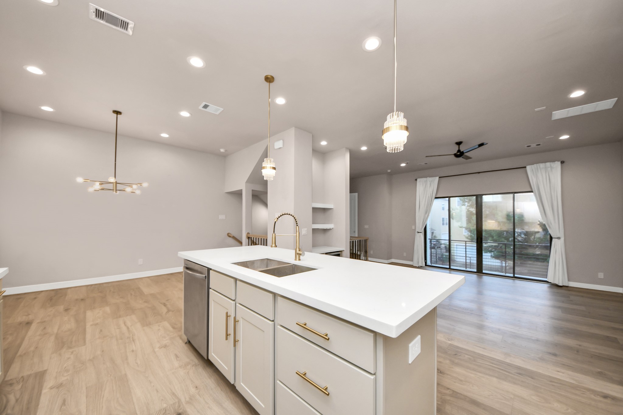 2114 Stuart Street Houston, TX 77004 - Photo 20 of 39 a kitchen with a sink chandelier and wooden floor