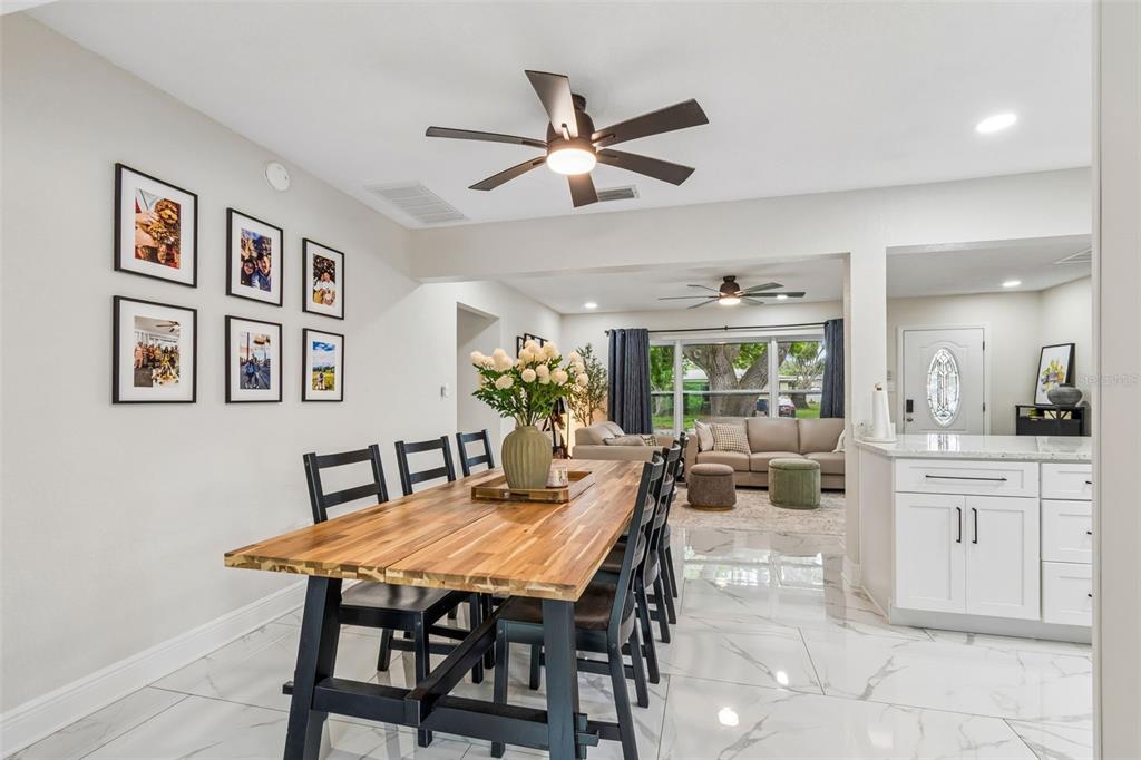 1618 Barry Road Clearwater, FL 33756 - Photo 26 of 71 a dining room with furniture and window