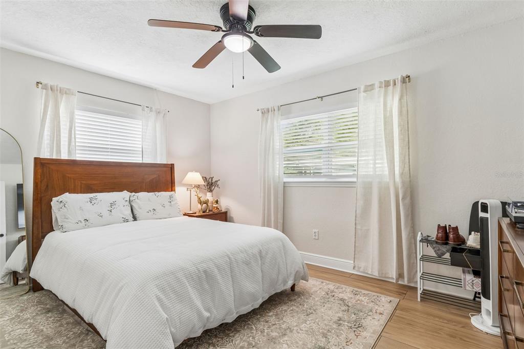 1618 Barry Road Clearwater, FL 33756 - Photo 30 of 71 a bedroom with a large bed and a window