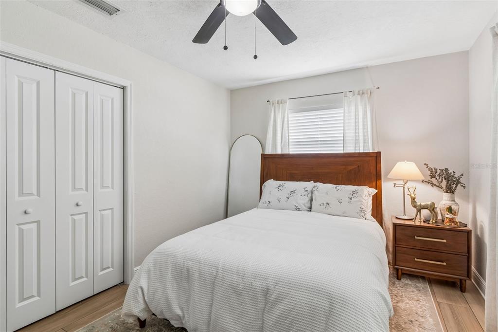 1618 Barry Road Clearwater, FL 33756 - Photo 32 of 71 a bedroom with a bed and a dresser