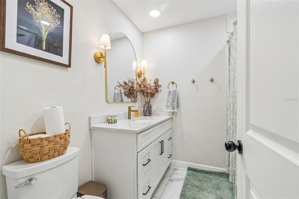 1618 Barry Road Clearwater, FL 33756 - Photo 38 of 71 a bathroom with a sink and a mirror