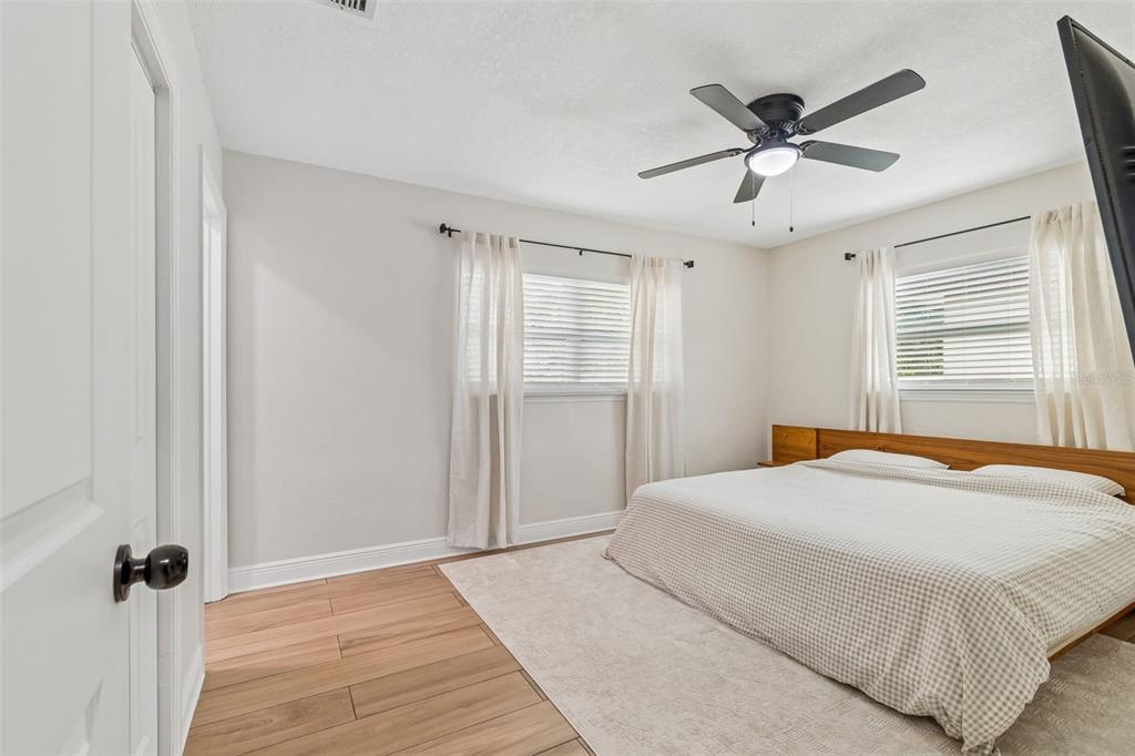 1618 Barry Road Clearwater, FL 33756 - Photo 46 of 71 a bedroom with a large bed and a window