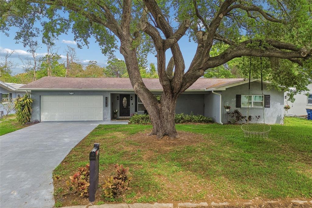 1618 Barry Road Clearwater, FL 33756 - Photo 5 of 71 a front view of a house with garden