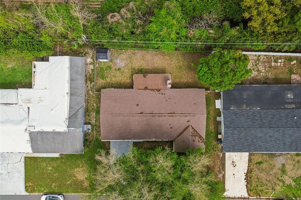1618 Barry Road Clearwater, FL 33756 - Photo 56 of 71 an aerial view of a house with a garden and lake view