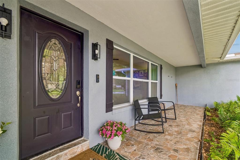 1618 Barry Road Clearwater, FL 33756 - Photo 6 of 71 a front view of a house with garden