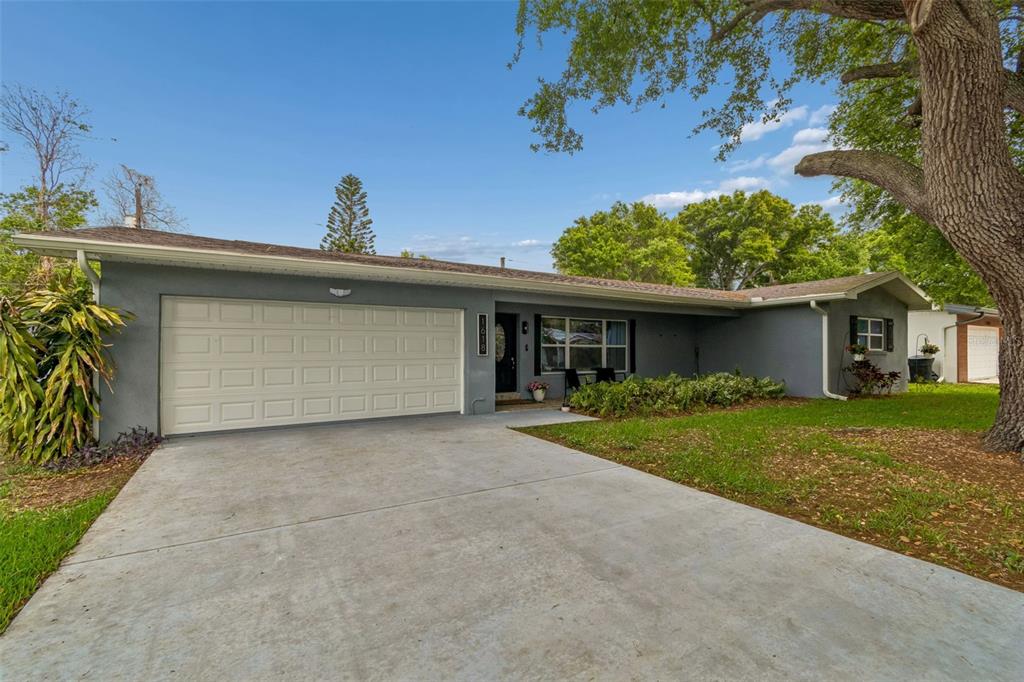 1618 Barry Road Clearwater, FL 33756 - Photo 66 of 71 front view of a house with a garden