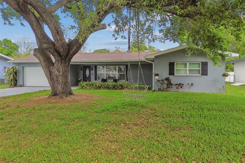 1618 Barry Road Clearwater, FL 33756 - Photo 67 of 71 a front view of house with yard and green space