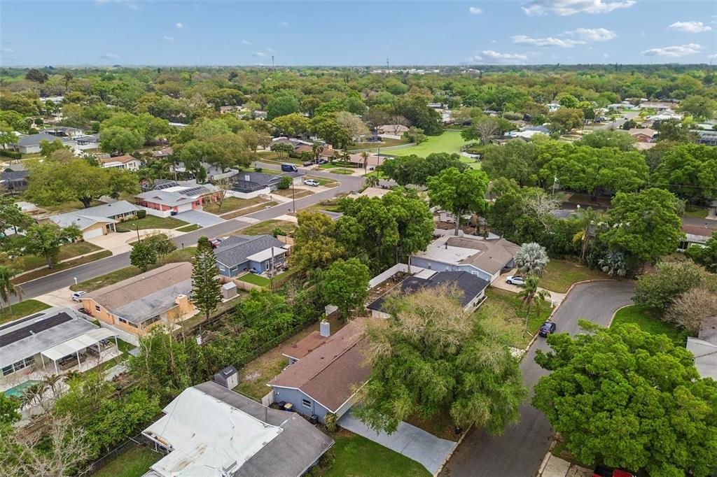 1618 Barry Road Clearwater, FL 33756 - Photo 8 of 71 an aerial view of residential house with outdoor space and trees all around