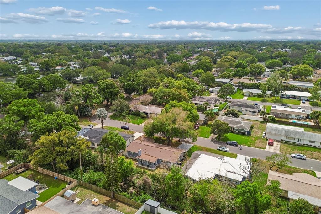 1618 Barry Road Clearwater, FL 33756 - Photo 9 of 71 an aerial view of residential houses with outdoor space and trees