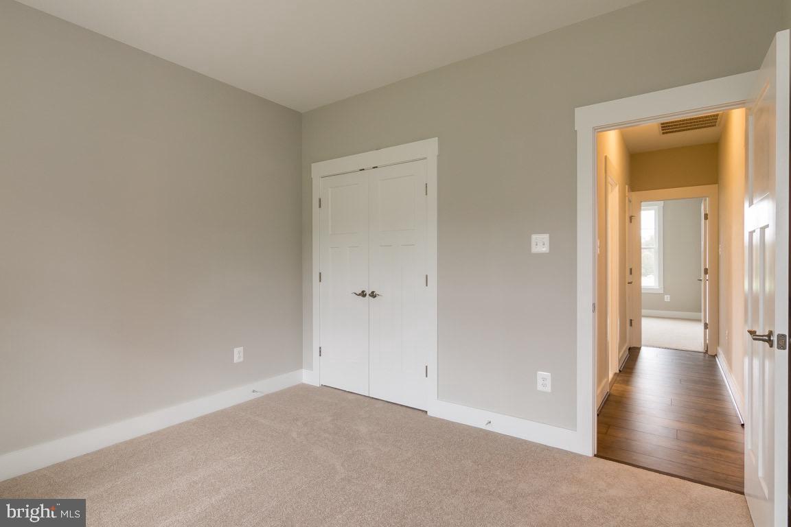 3100 Thurston Road Frederick, MD 21704 - Photo 29 of 35 a view of a hallway with wooden floor