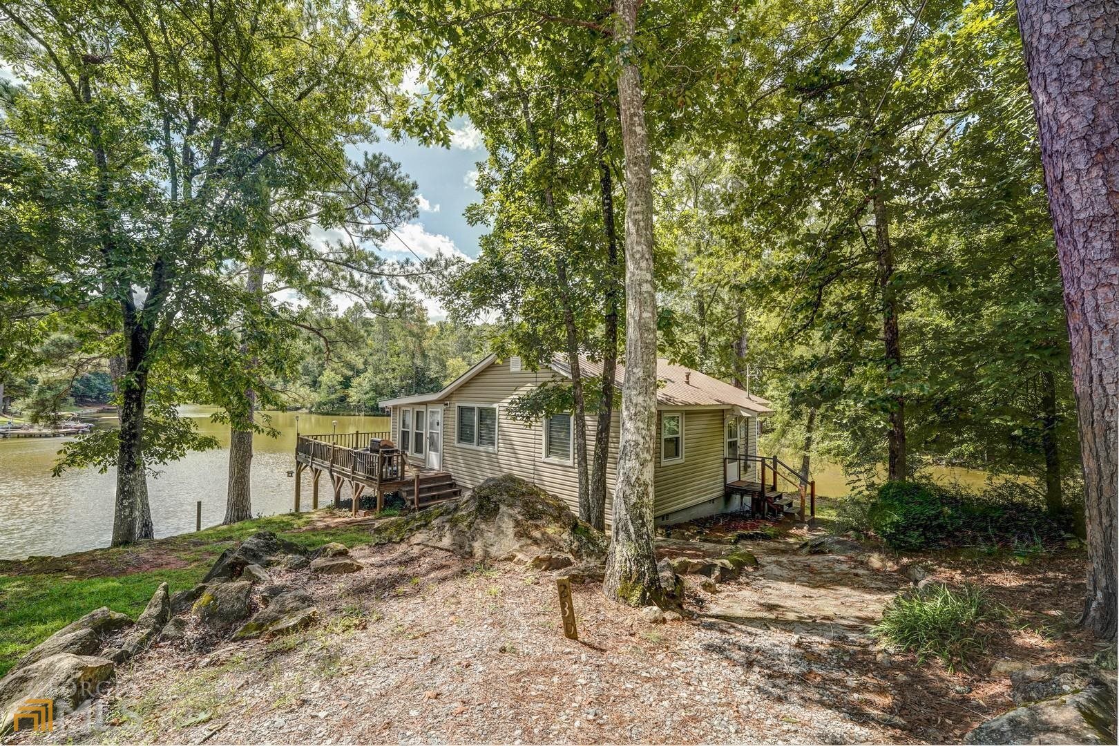 230 Airstrip Road Jackson, GA 30233 - Photo 1 of 1 a view of a yard with a tree and a small yard