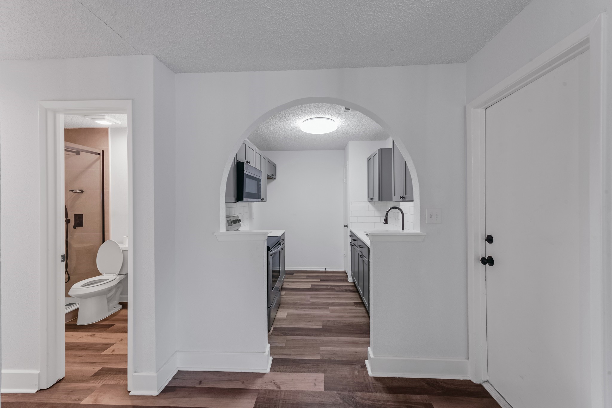 23426 Prairie Bird Drive Spring, TX 77373 - Photo 12 of 34 a view of a hallway with wooden floor and entryway