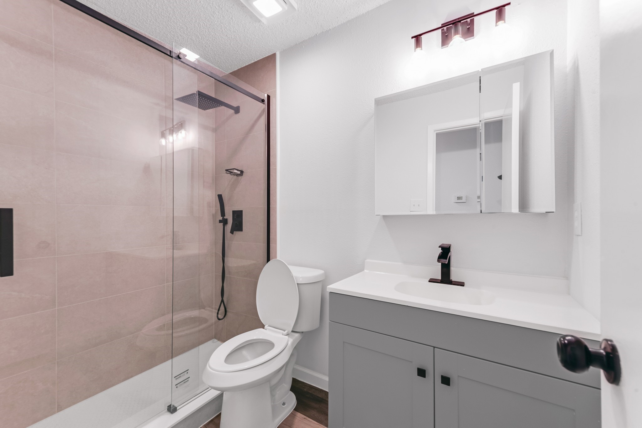 23426 Prairie Bird Drive Spring, TX 77373 - Photo 20 of 34 a bathroom with a sink a toilet and shower