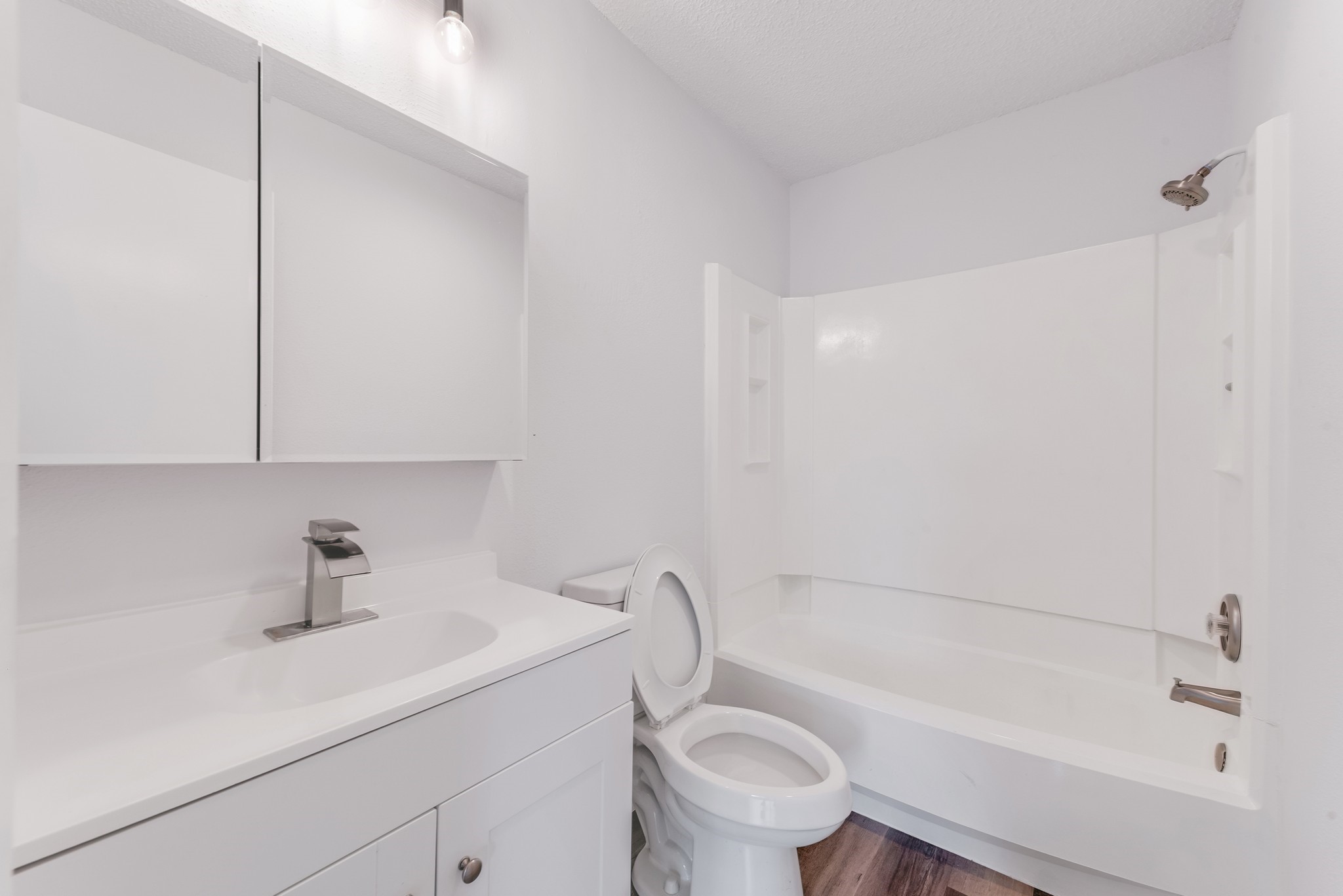23426 Prairie Bird Drive Spring, TX 77373 - Photo 26 of 34 a bathroom with a sink a toilet and shower