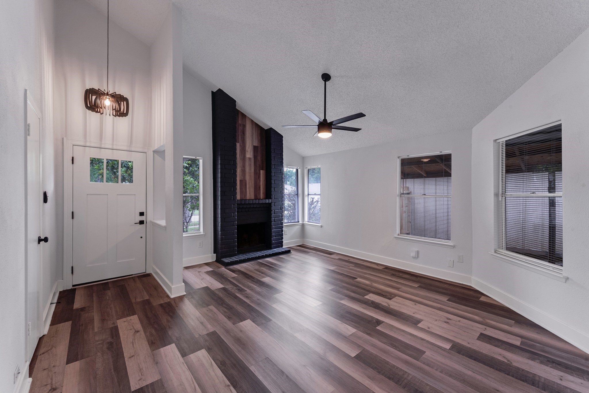 23426 Prairie Bird Drive Spring, TX 77373 - Photo 4 of 34 a view of an empty room with wooden floor and a window