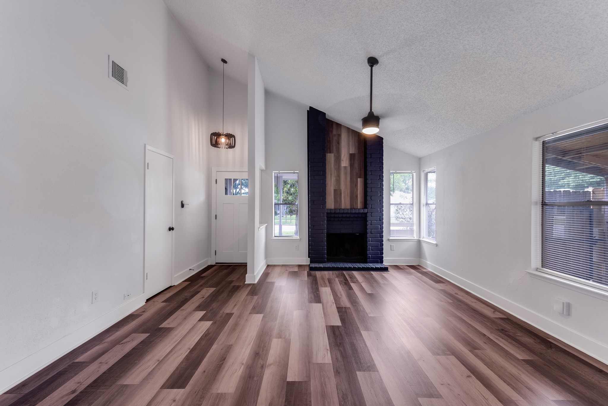 23426 Prairie Bird Drive Spring, TX 77373 - Photo 6 of 34 a view of an empty room with window and wooden floor