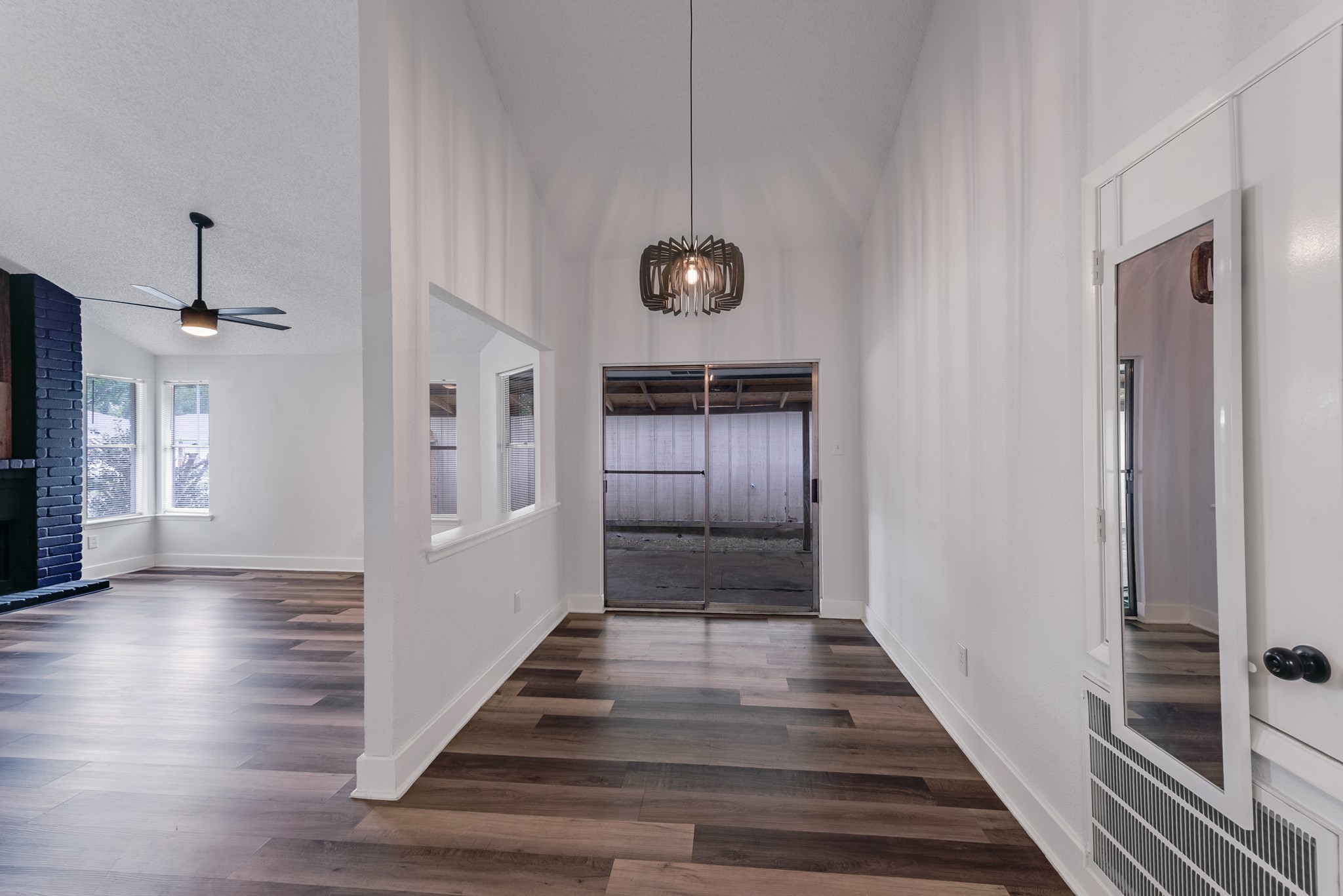 23426 Prairie Bird Drive Spring, TX 77373 - Photo 8 of 34 a view of a hallway with wooden floor and staircase