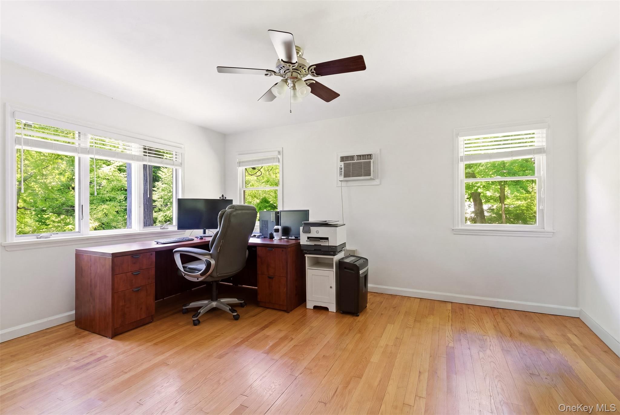 106 Vineyard Road Huntington, NY 11743 - Photo 7 of 25 a view of a workspace with furniture and a window