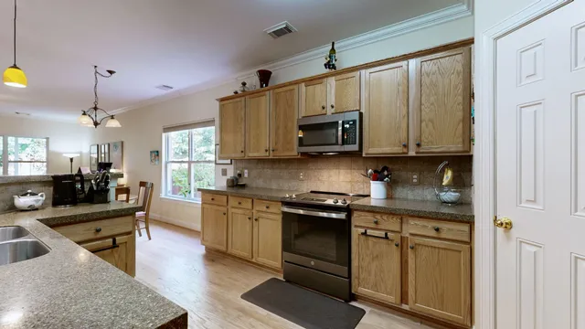 a bedroom with furniture and a chandelier
