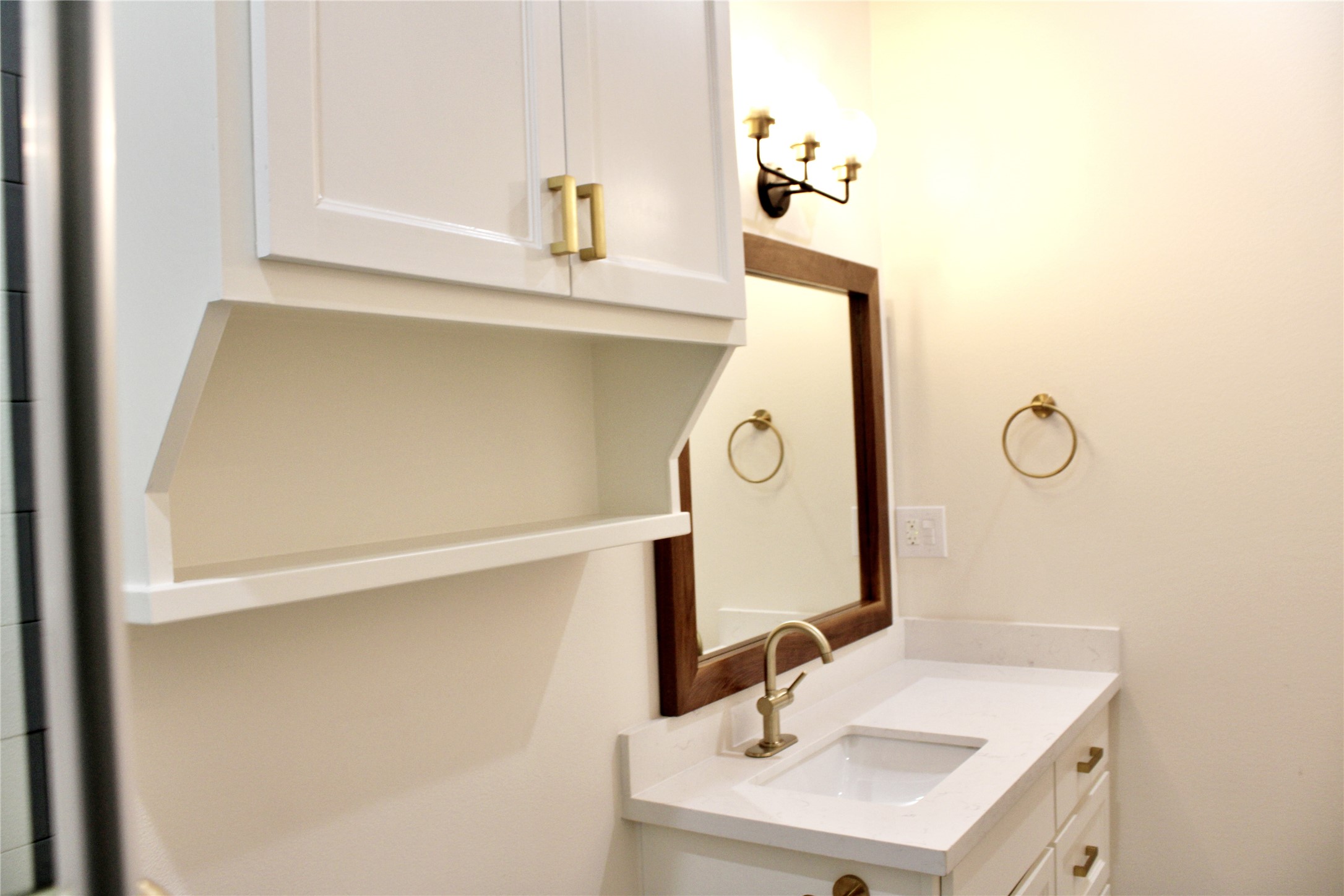 678 Colorado Street Glidden, TX 78943 - Photo 14 of 48 a bathroom with a sink and a mirror