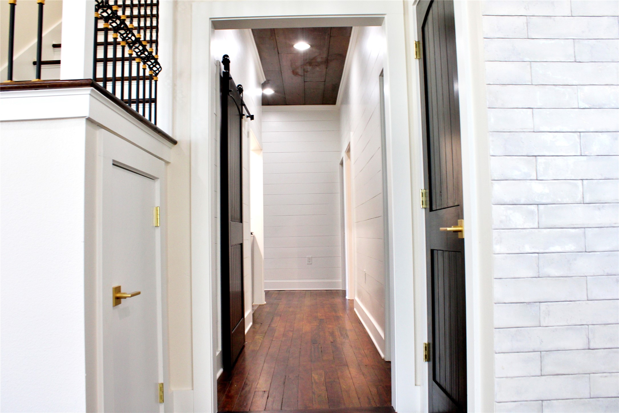 678 Colorado Street Glidden, TX 78943 - Photo 15 of 48 a view of a hallway with wooden floor and staircase