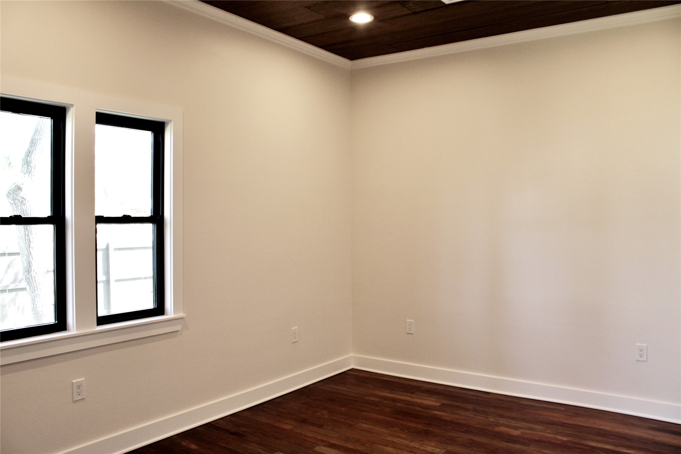 678 Colorado Street Glidden, TX 78943 - Photo 23 of 48 a view of an empty room with wooden floor and a window