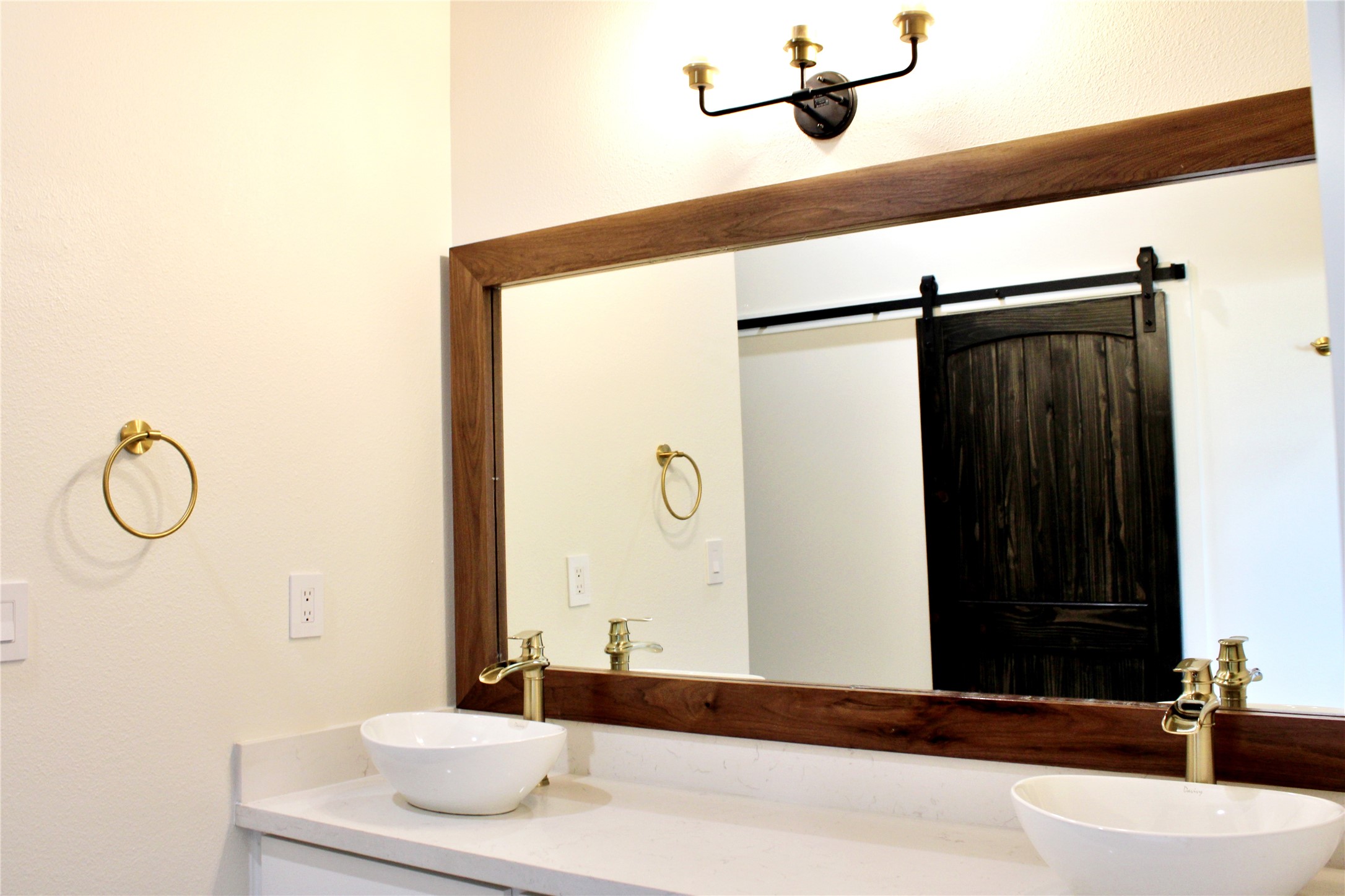 678 Colorado Street Glidden, TX 78943 - Photo 28 of 48 a bathroom with a granite countertop sink and a mirror
