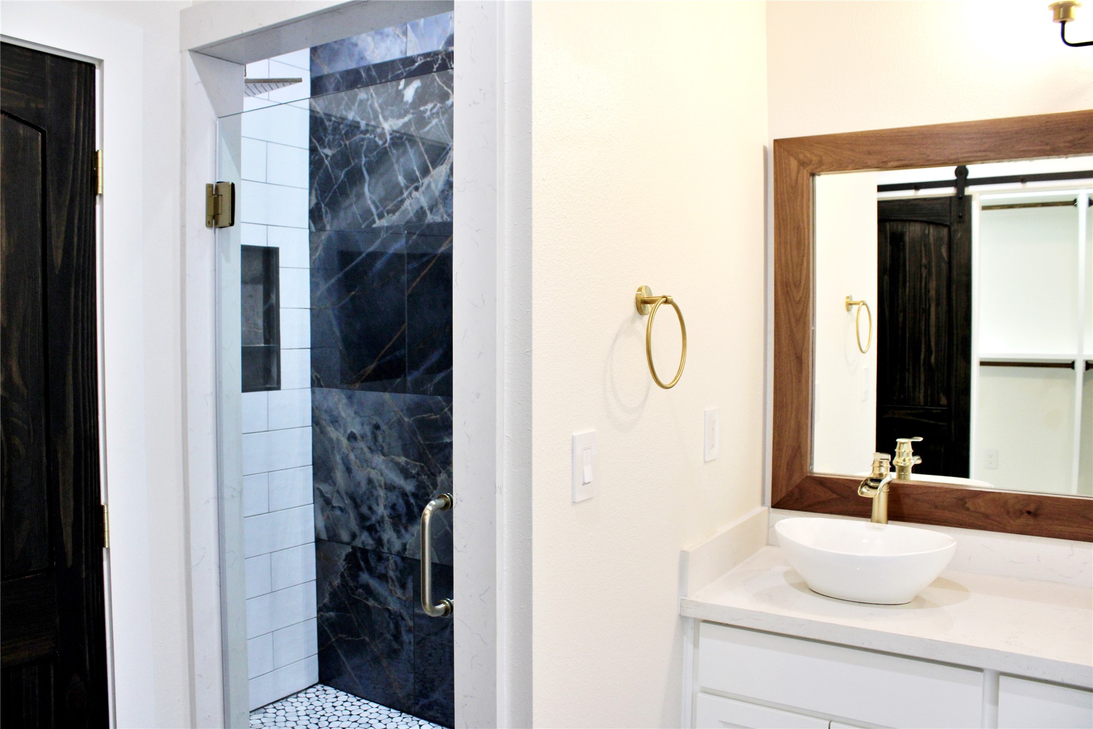 678 Colorado Street Glidden, TX 78943 - Photo 30 of 48 a bathroom with a granite countertop shower sink and mirror