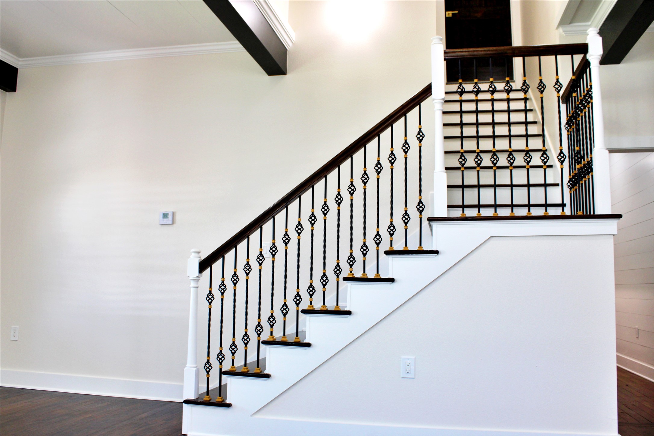 678 Colorado Street Glidden, TX 78943 - Photo 35 of 48 a view of staircase with lots of frames on wall and a window
