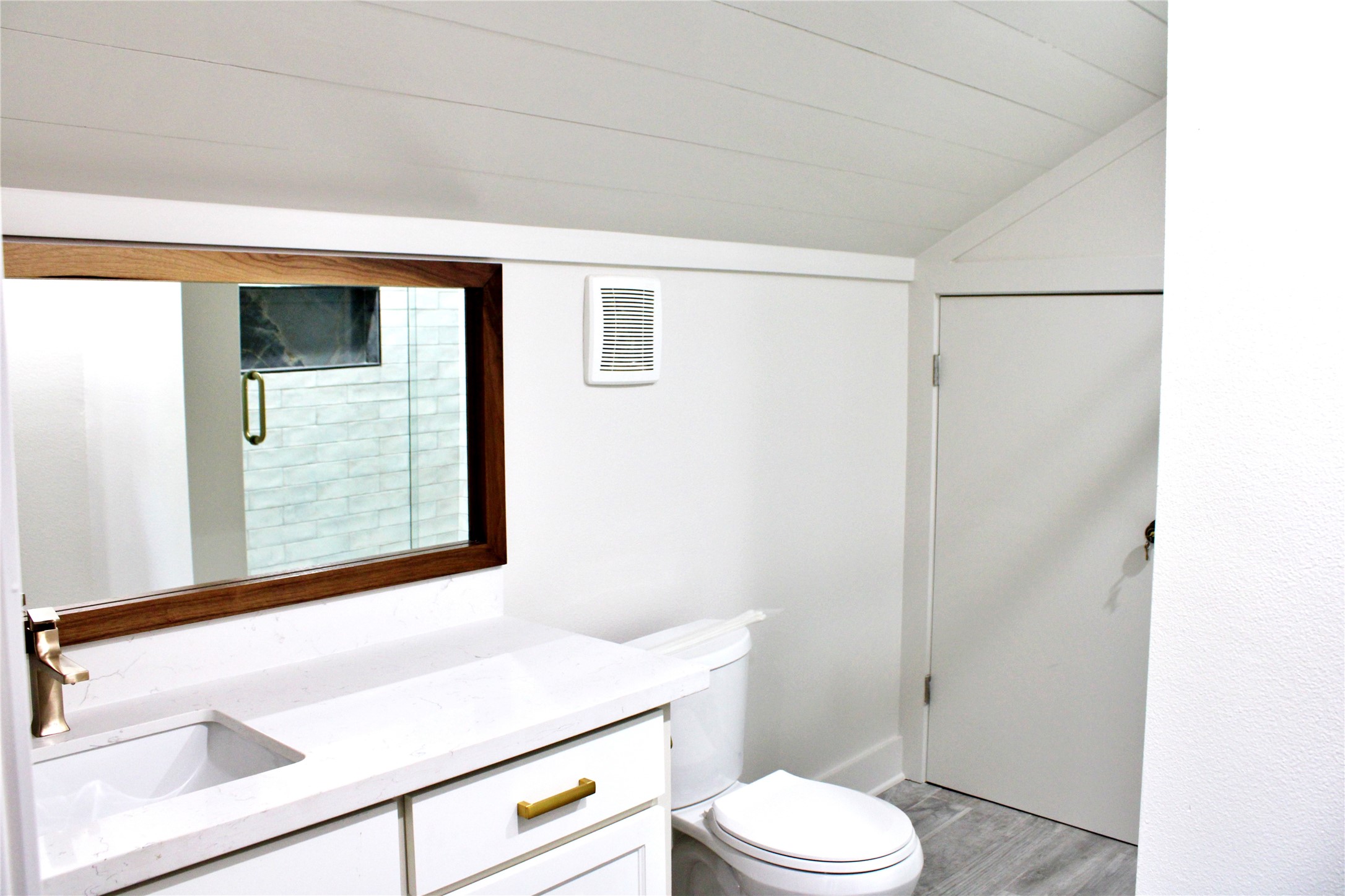 678 Colorado Street Glidden, TX 78943 - Photo 42 of 48 a bathroom with a sink a toilet a vanity and shower