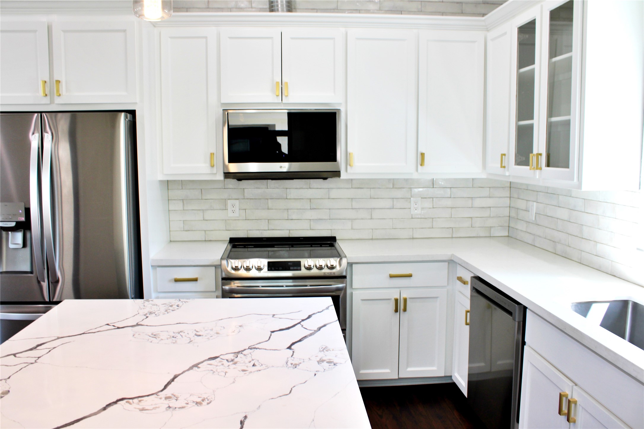 678 Colorado Street Glidden, TX 78943 - Photo 5 of 48 a kitchen with a stove and a microwave