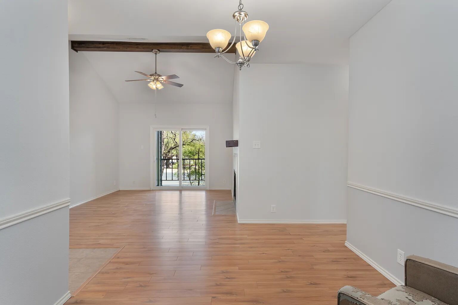 11970 Jollyville Road, Unit 202 Austin, TX 78759 - Photo 5 of 25 Hardwood floors and a fireplace feature this open living area with an outdoor balcony.