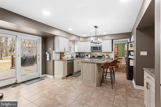 a kitchen with a sink cabinets and stainless steel appliances