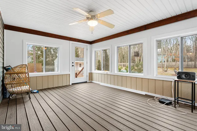 a view of a room with wooden floor and balcony
