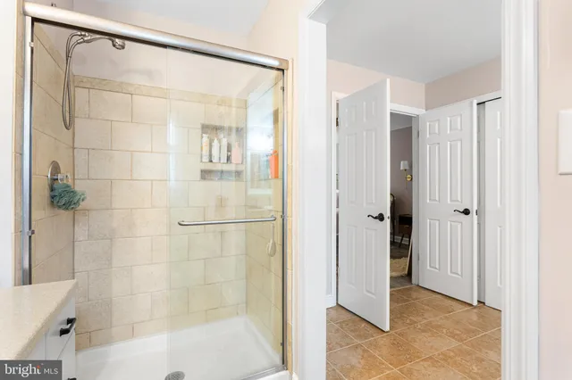 a bathroom with a shower and a tub