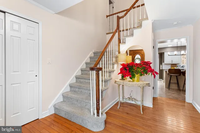 a view of entryway dining room and hall with wooden floor
