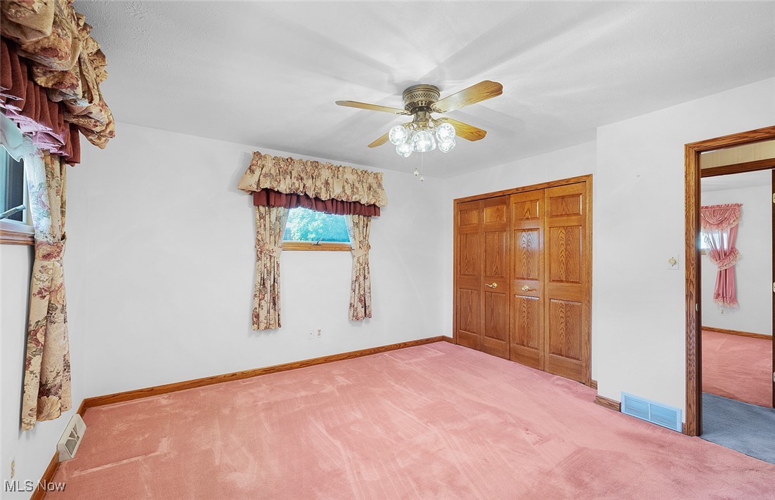 5611 Ralston Drive Parma, OH 44129 - Photo 18 of 39 Unfurnished bedroom with carpet floors, a closet, and ceiling fan