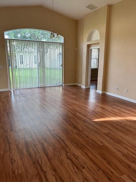 5642 Sunberry Circle Fort Pierce, FL 34951 - Photo 2 of 11 an empty room with wooden floor and windows