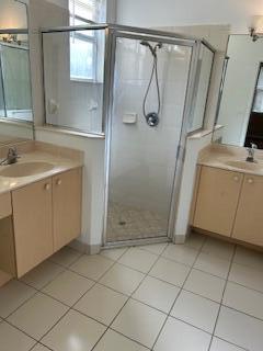 5642 Sunberry Circle Fort Pierce, FL 34951 - Photo 5 of 11 a bathroom with a shower and a sink