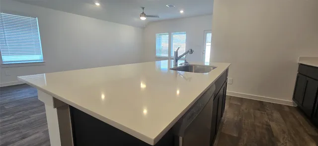 a view of kitchen island with wooden floor