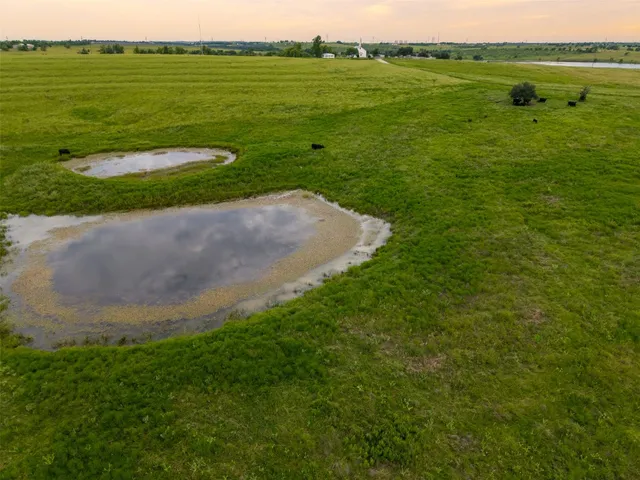 a view of a lake with a big yard