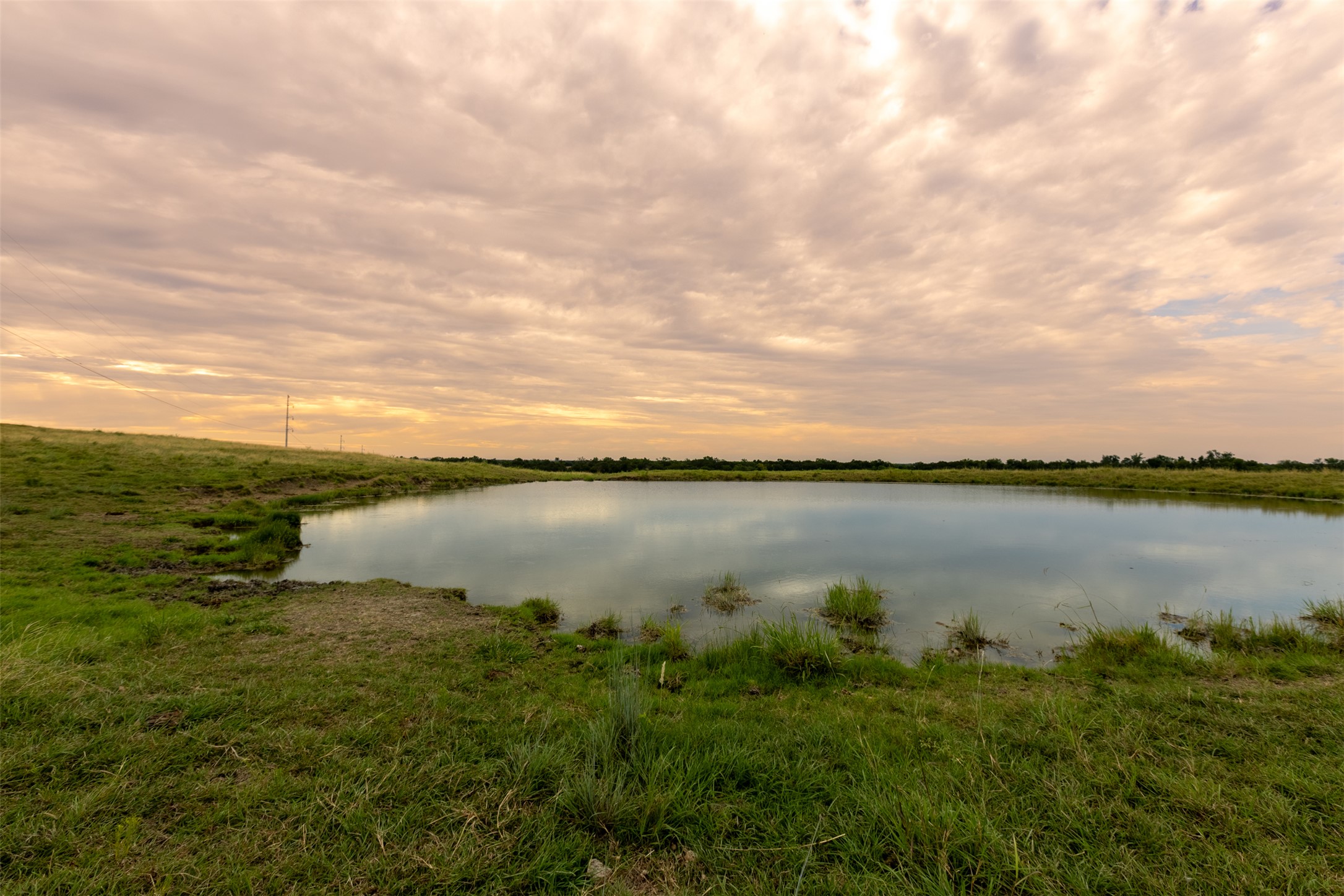 10966 Stringtown Road Temple, TX 76501 - Photo 4 of 24 a view of a lake from a yard
