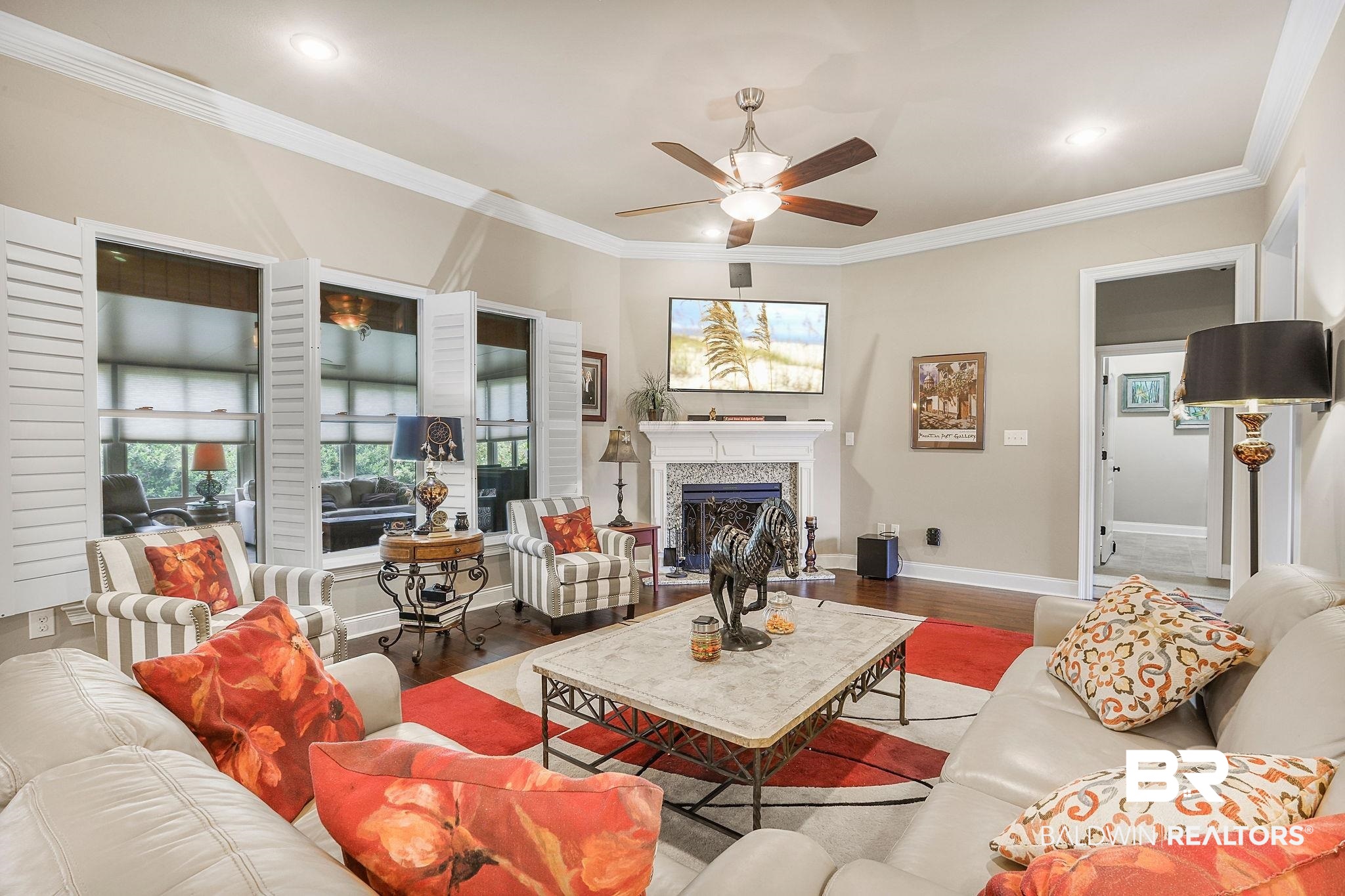 1090 Destin Avenue Foley, AL 36535 - Photo 5 of 30 Living area featuring wood finished floors, a ceiling fan, a fireplace, crown molding, and recessed lighting