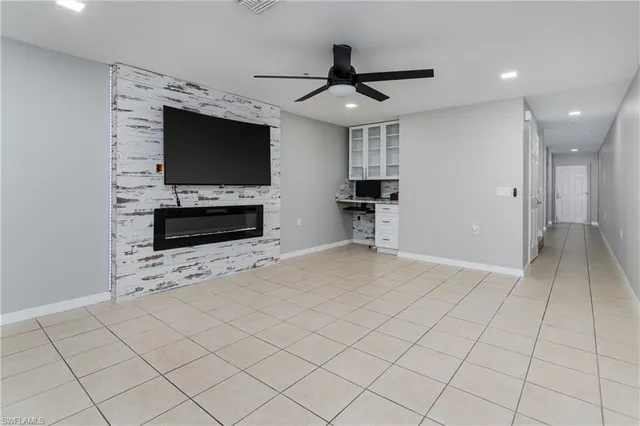 a view of a livingroom with furniture and a flat screen tv