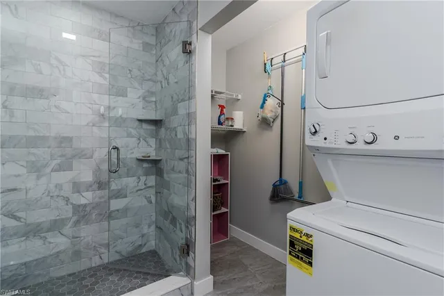 a bathroom with a shower and a sink