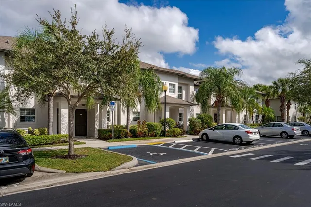 a city street lined with buildings and trees